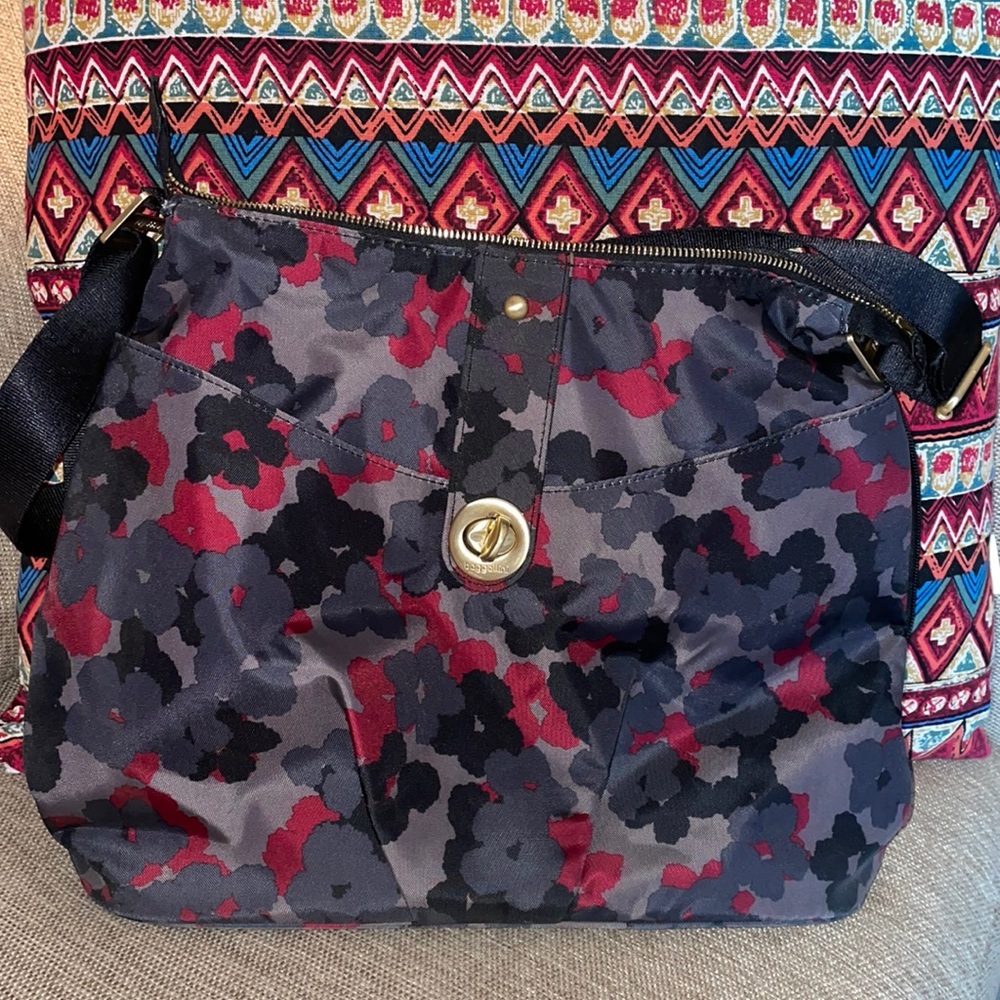 Baggalini Helsinki crossbody purse. Black with floral grays and maroon.
